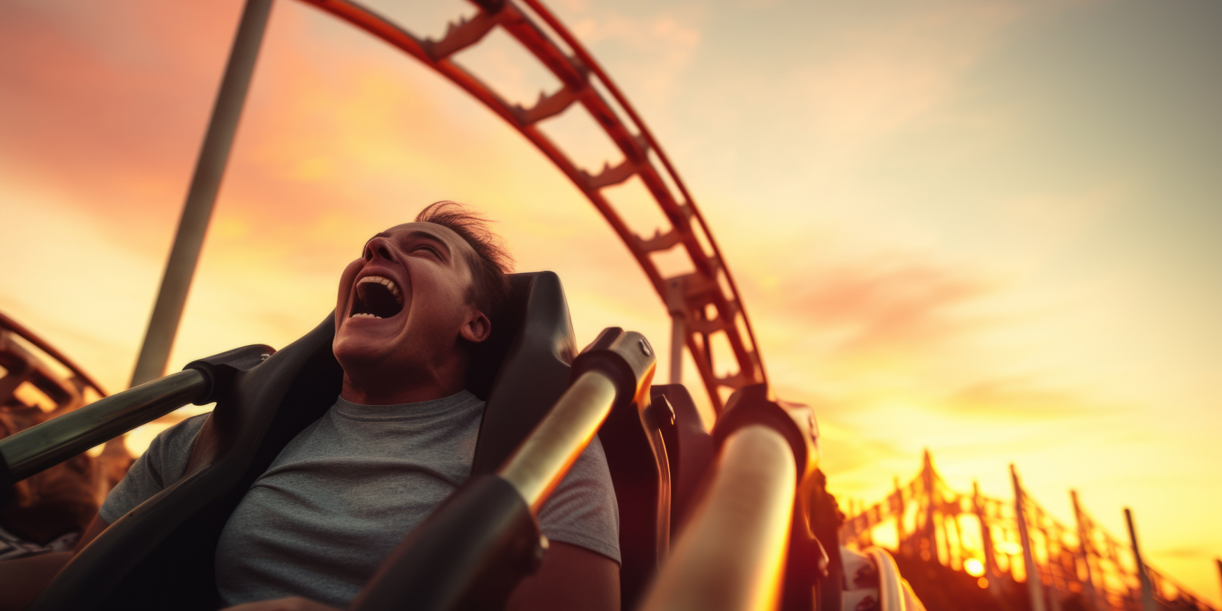 Man enjoying a rollercoaster at sunset